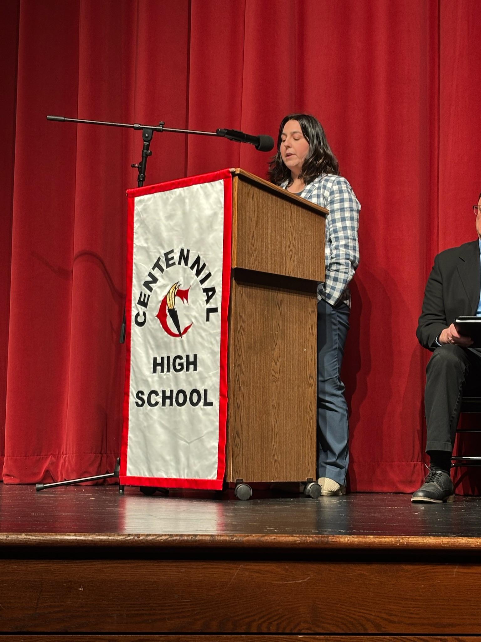 Gloria speaking at Centennial High School
